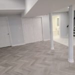 Transforming a home's flooring: Highlighting a beautiful herringbone pattern during a full house renovation.