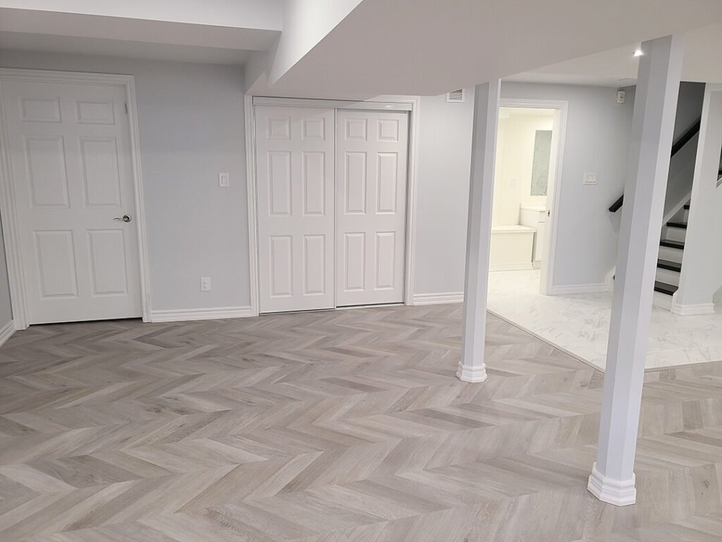 Transforming a home's flooring: Highlighting a beautiful herringbone pattern during a full house renovation.